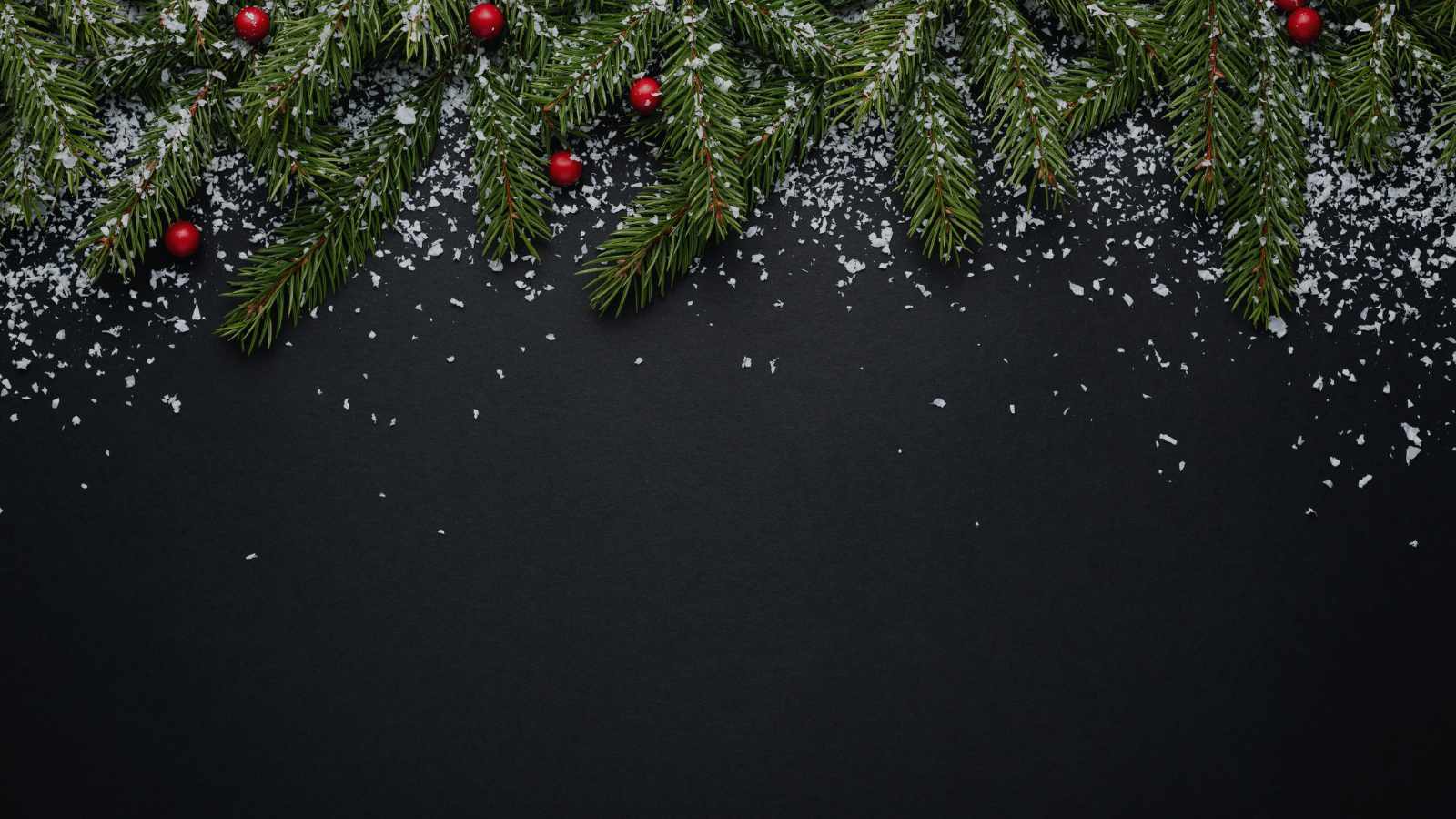 Christmas-themed decoration with pine branches and snowflakes