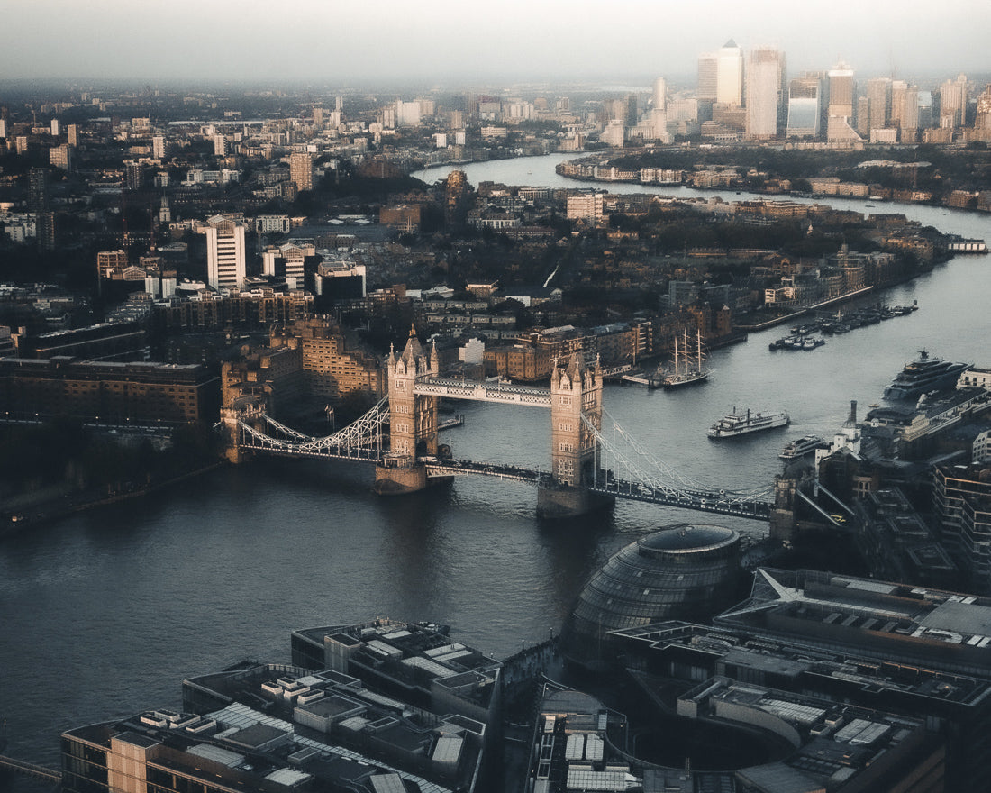 Aerial view of the Tower Bridge in London with a cityscape background