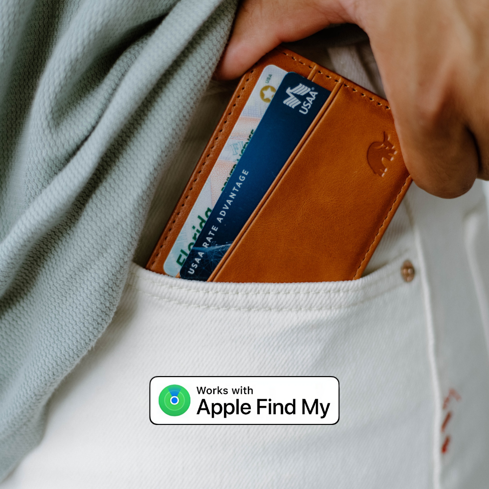 Leather card wallet in pocket, cards visible; badge: Works with Apple Find My; card text: USAA RATE ADVANTAGE Florida