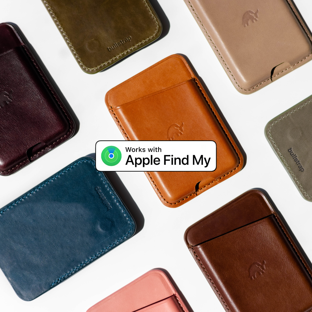 Various leather wallets in different colors with a label stating 'Works with Apple Find My'.