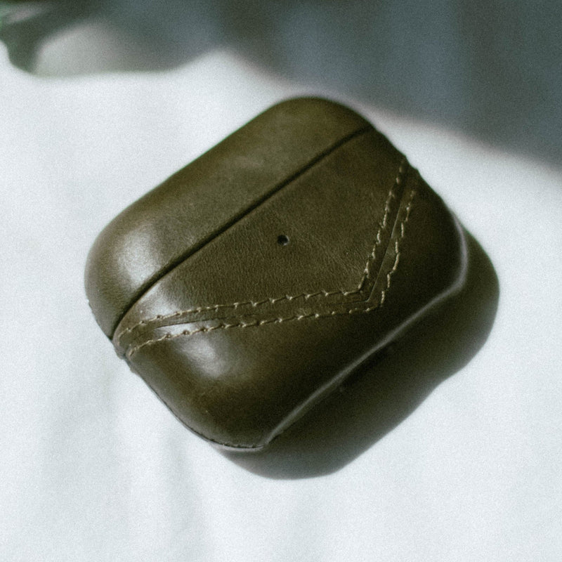 Olive green leather AirPods case with stitching details