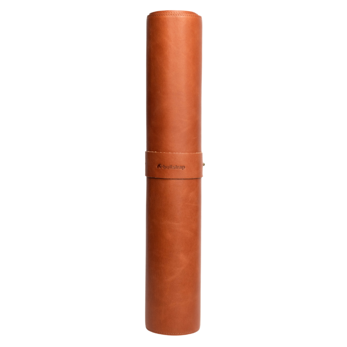 Rolled leather desk mat in a brown color, showcasing its texture and design.