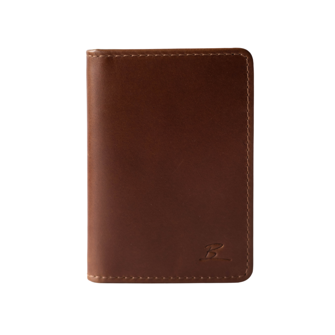 Brown leather wallet with a small embossed letter 'B' in the lower right corner, visible stitching along edges.