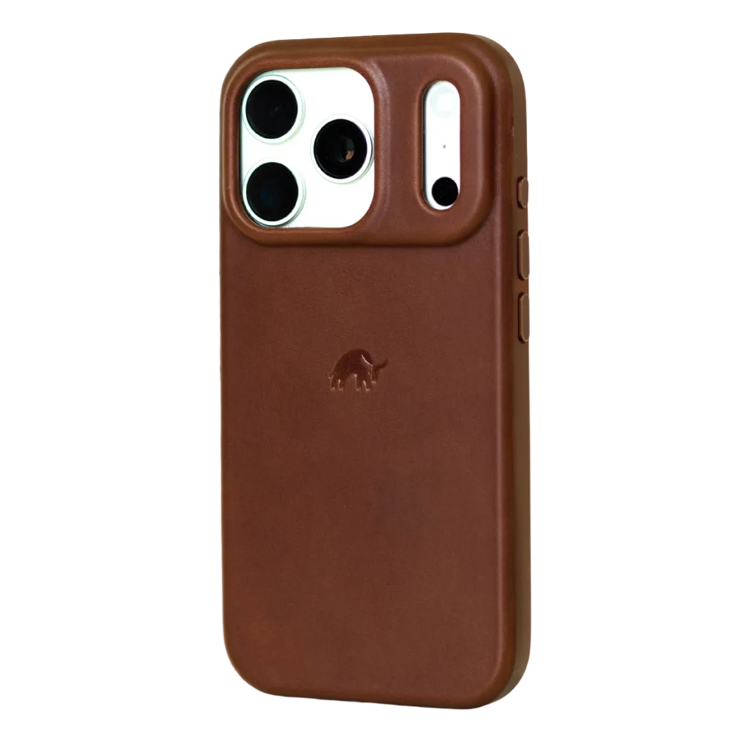 Angled rear view of The Flex Case in Terra brown leather showing raised camera lip, embossed elephant logo and side buttons