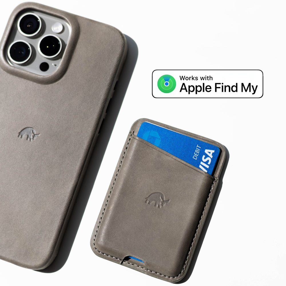 Leather phone case and matching card wallet with blue card labeled DEBIT VISA; badge reads 'Works with Apple Find My'