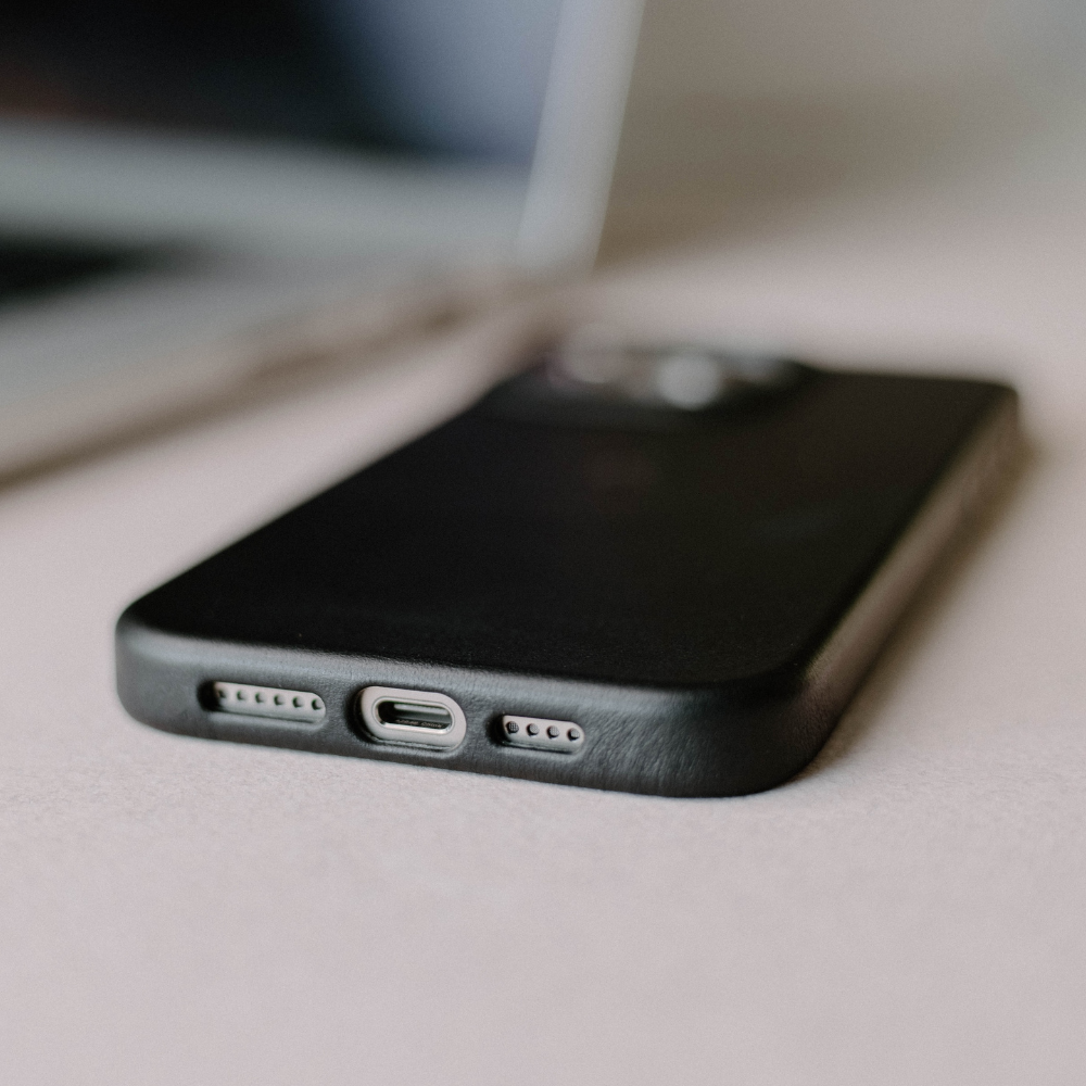 The New Contemporary Case in black, showing the bottom with charging port and buttons
