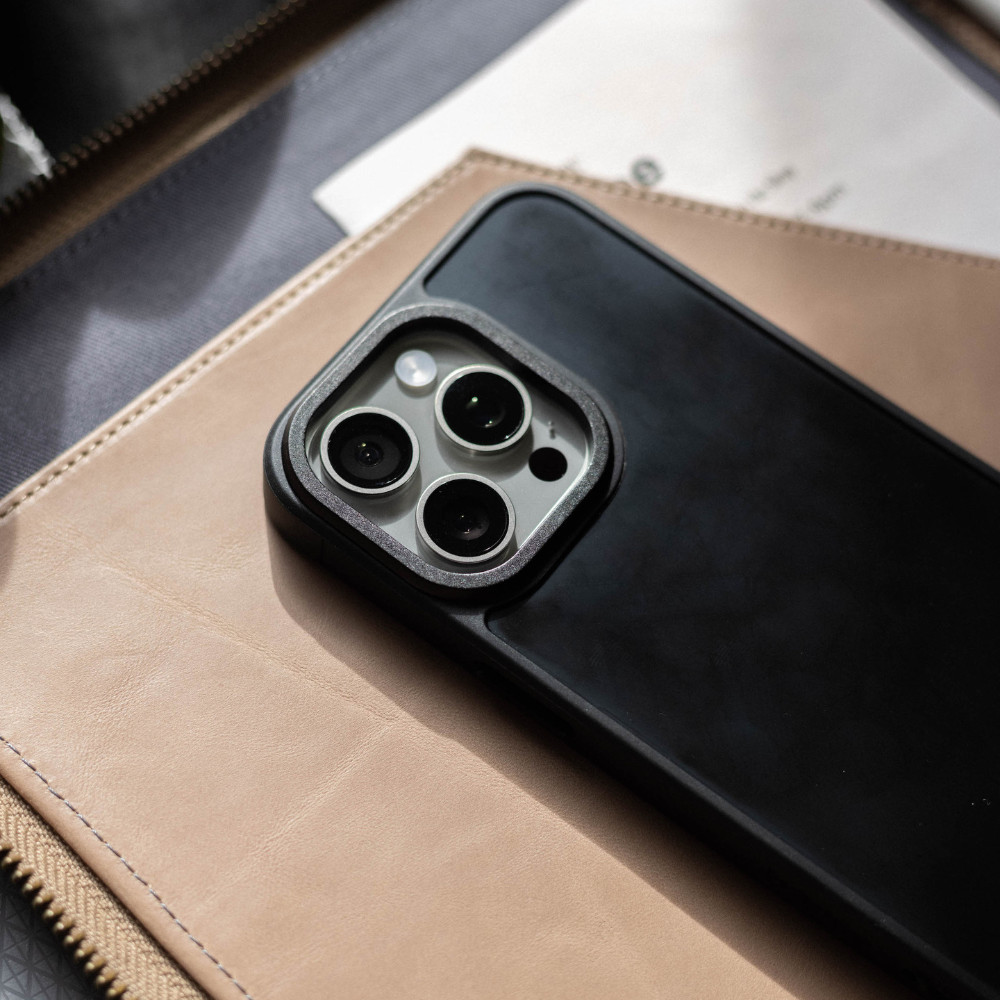 Close-up of a phone case on a surface, showing camera cutouts