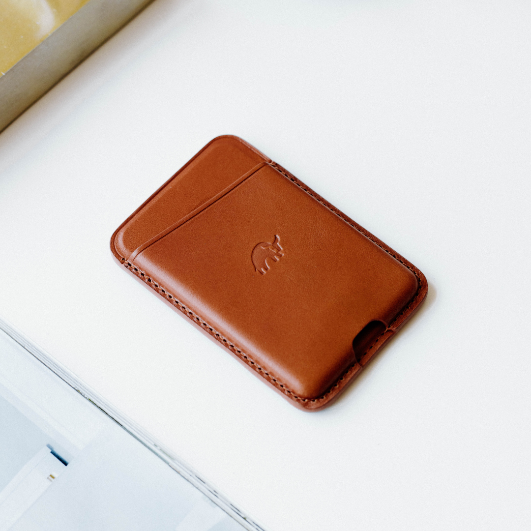 Sienna brown MagSafe leather card wallet with embossed elephant logo and single front card slot.