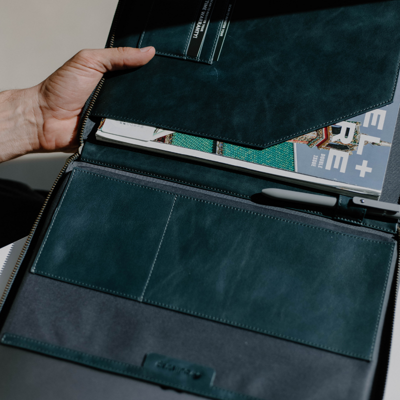 Open interior view of Leather MacBook sleeve in Ocean showing card slots, document pocket, and pen loop