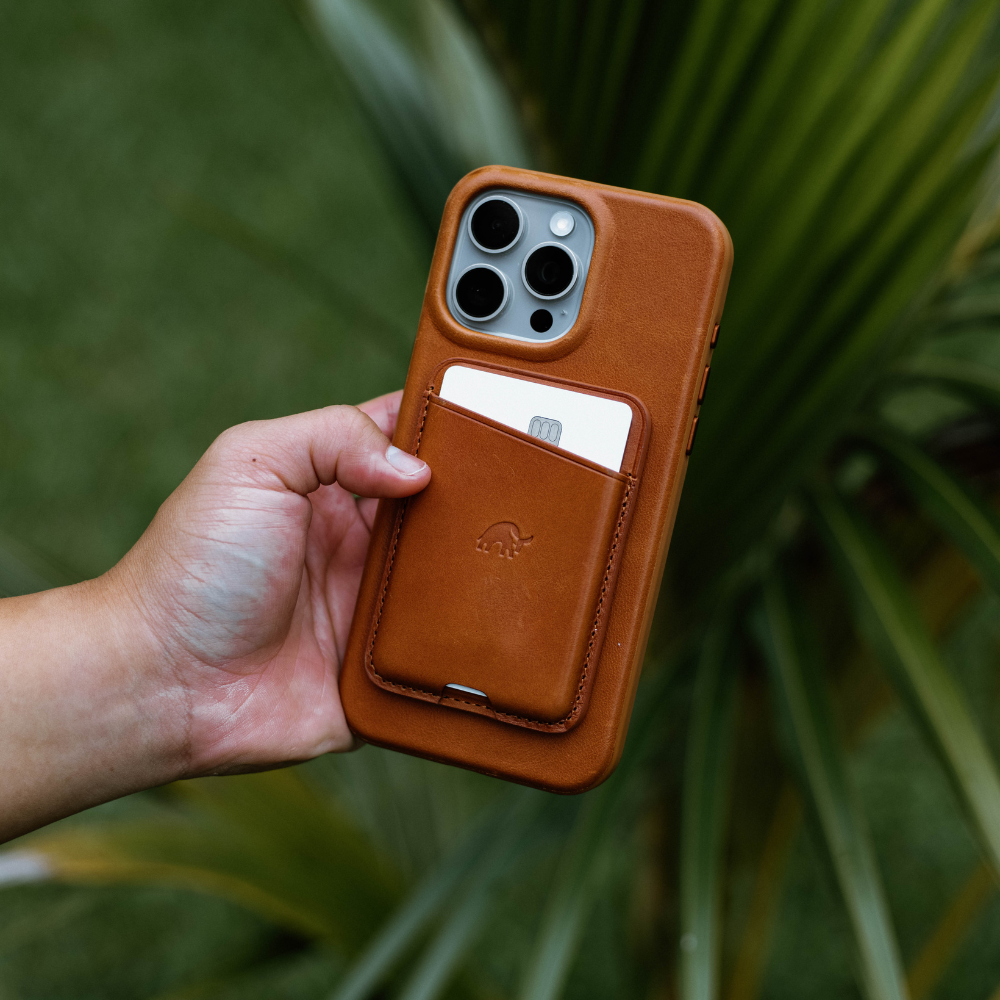 A person holding the Flex Case in SIENNA color with a card slot, showcasing its design and functionality.