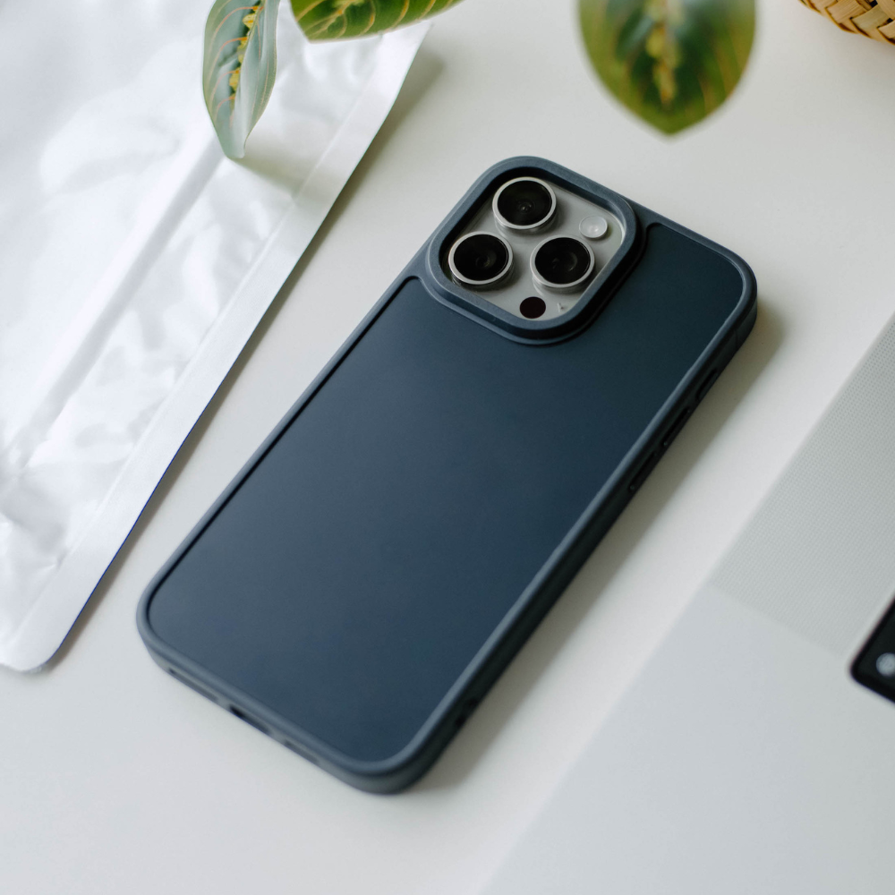 Dark blue phone case for iPhone with three camera lenses visible