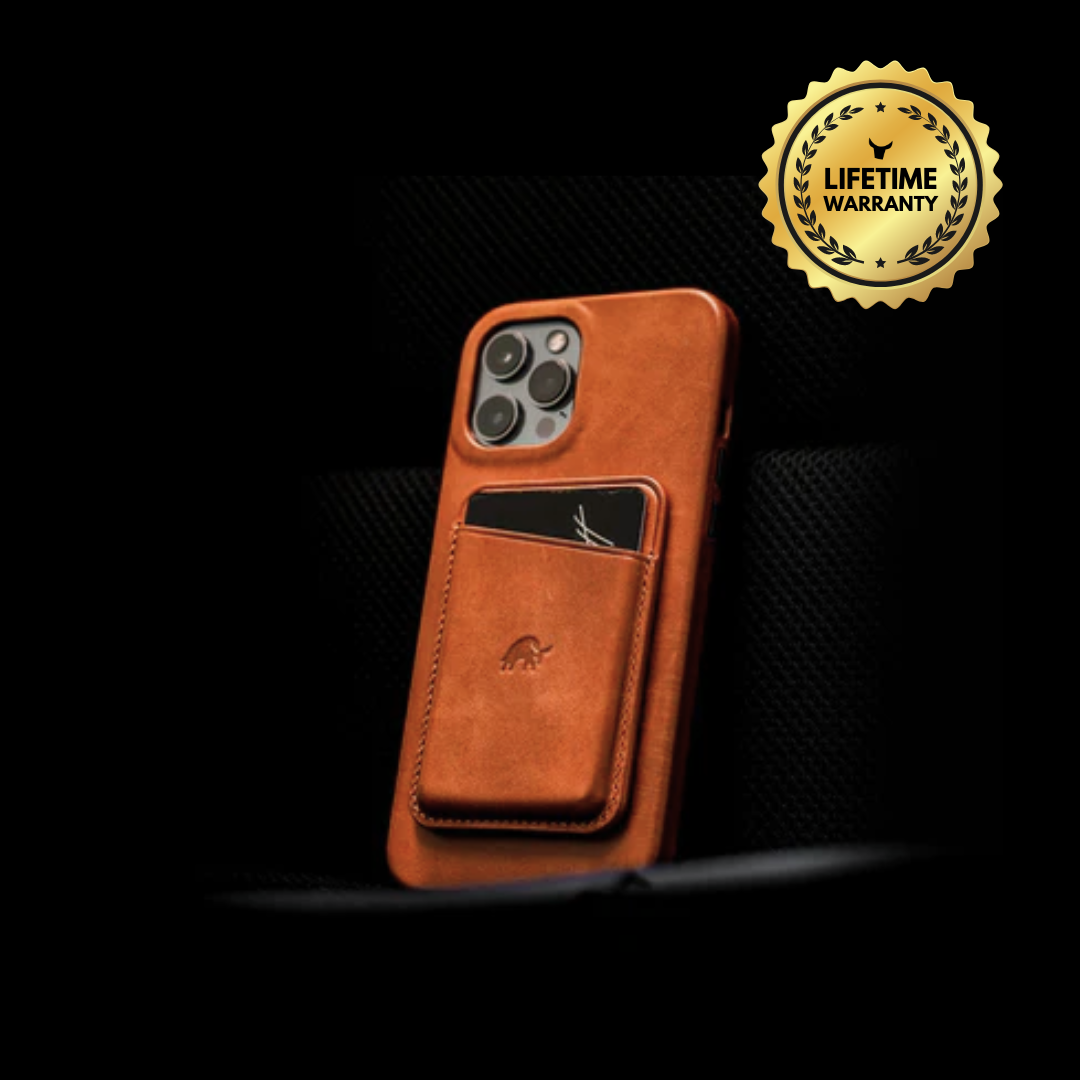 Tan leather iPhone case with external card pocket and gold seal reading LIFETIME WARRANTY