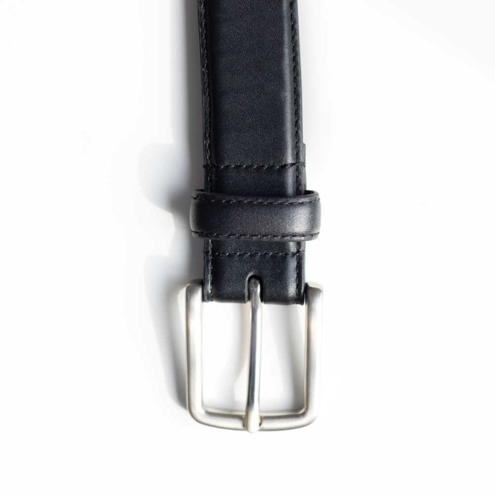 The signature belt in black with a silver buckle