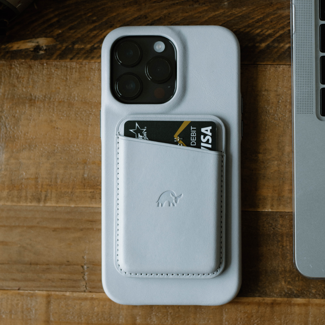 Minimalist iPhone case in CLOUD color with a card in the pocket