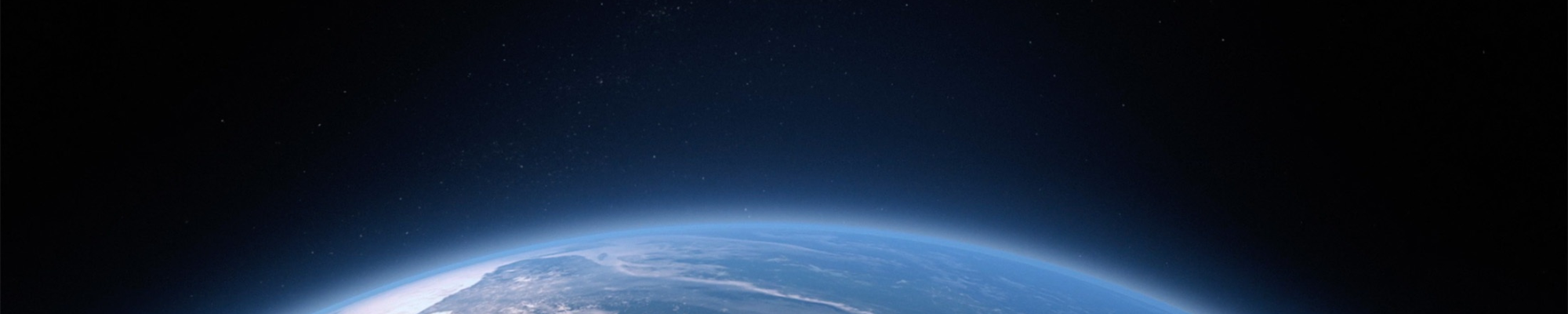 A view of Earth from space with a dark background and stars