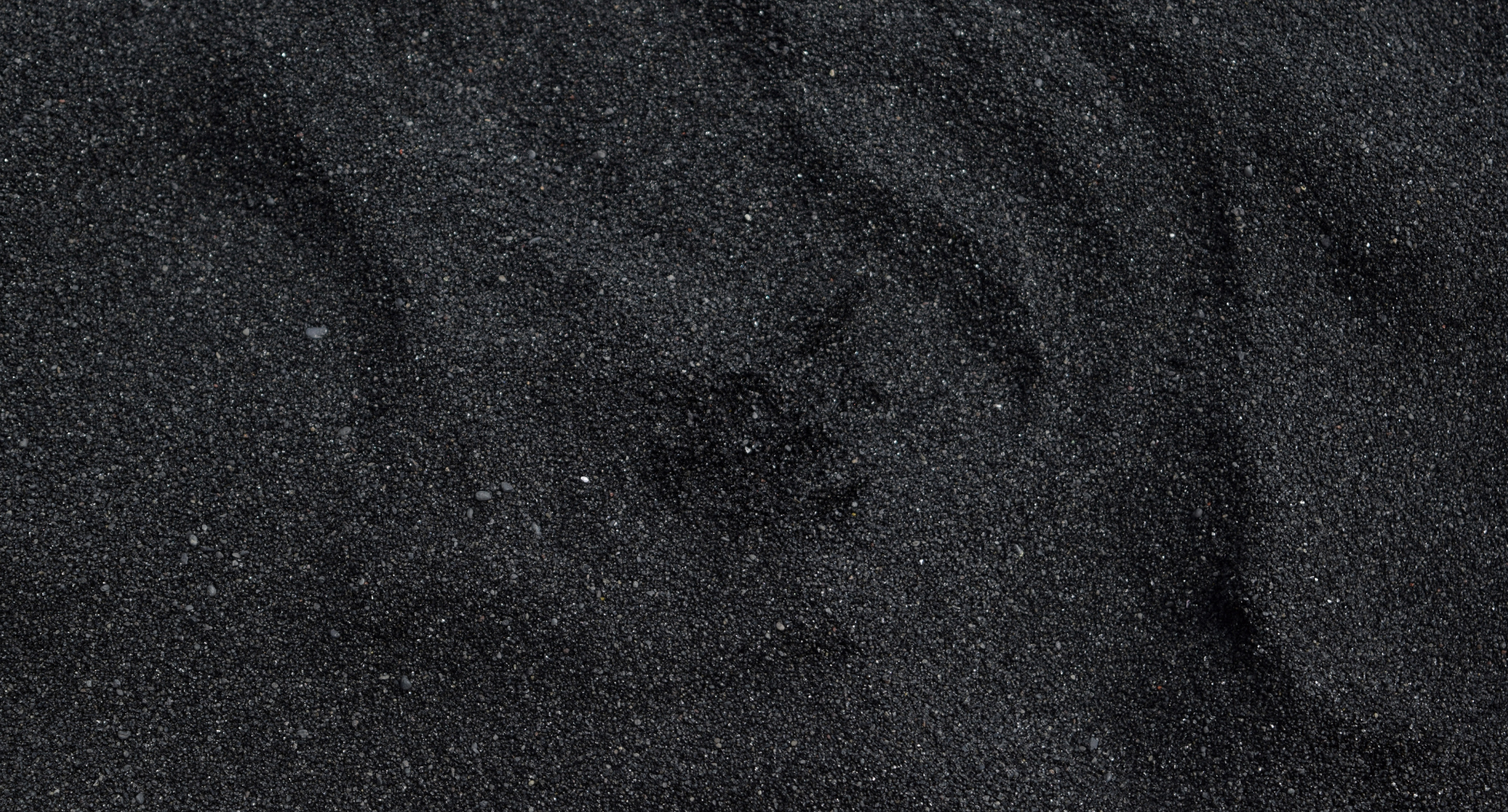Close-up of black sand texture