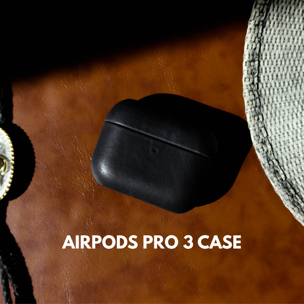 Black leather AirPods Pro 3 case on brown leather surface; visible text: AIRPODS PRO 3 CASE