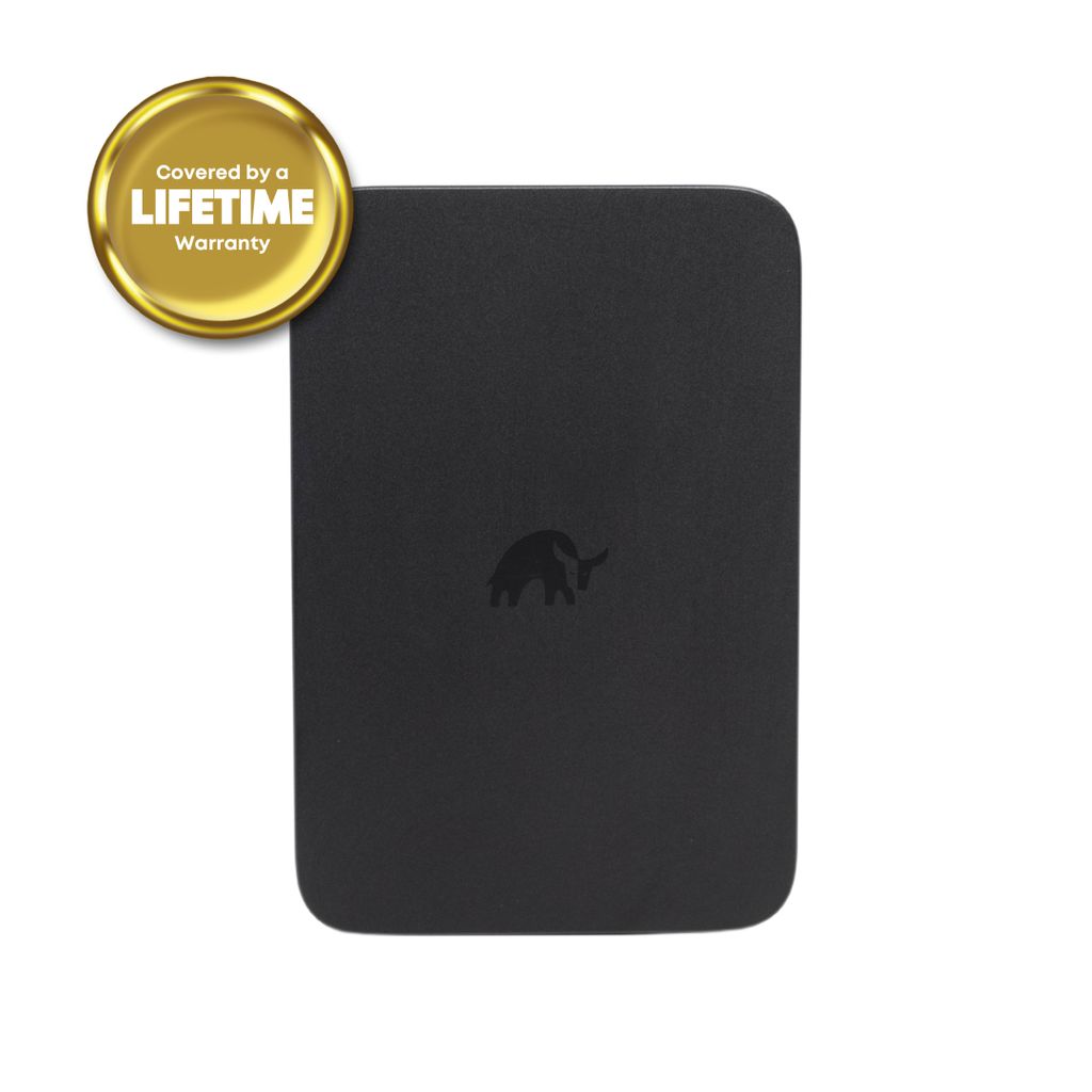 Black rectangular MagSafe power bank with centered elephant logo; gold badge reads "Covered by a LIFETIME Warranty".