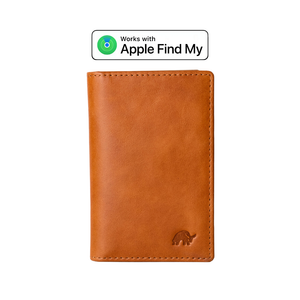 Brown leather wallet with embossed elephant logo below. Above it, a label reads 'Works with Apple Find My' with a green radar icon.