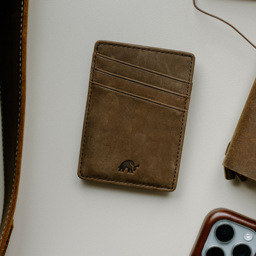 The Money Clip wallet in Terra color with three card slots and embossed logo