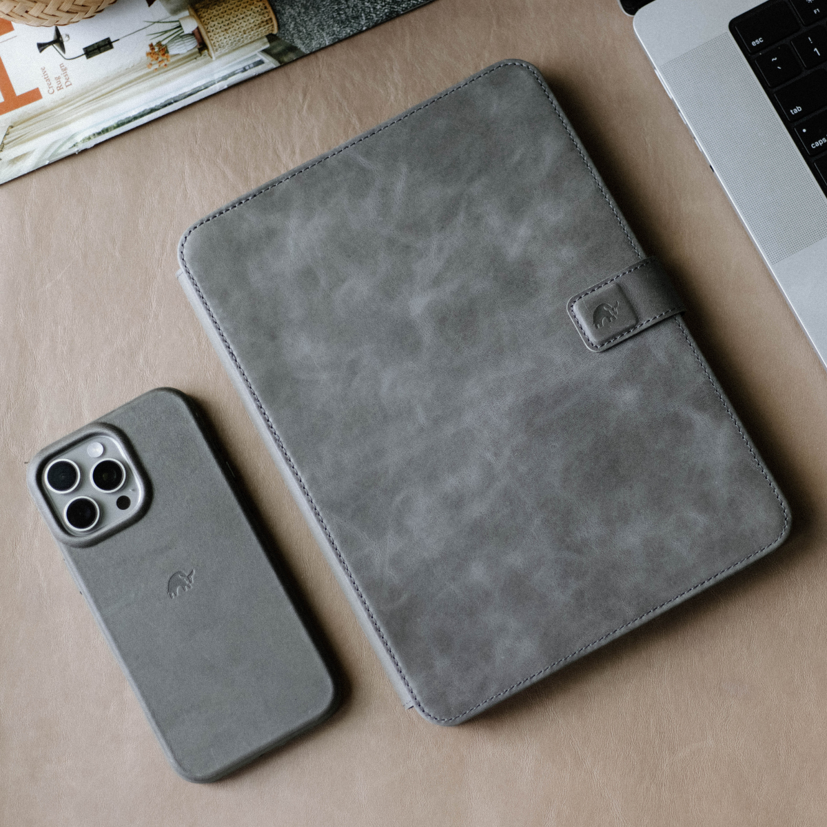 Leather iPad Case - SLATE and matching iPhone case on a desk