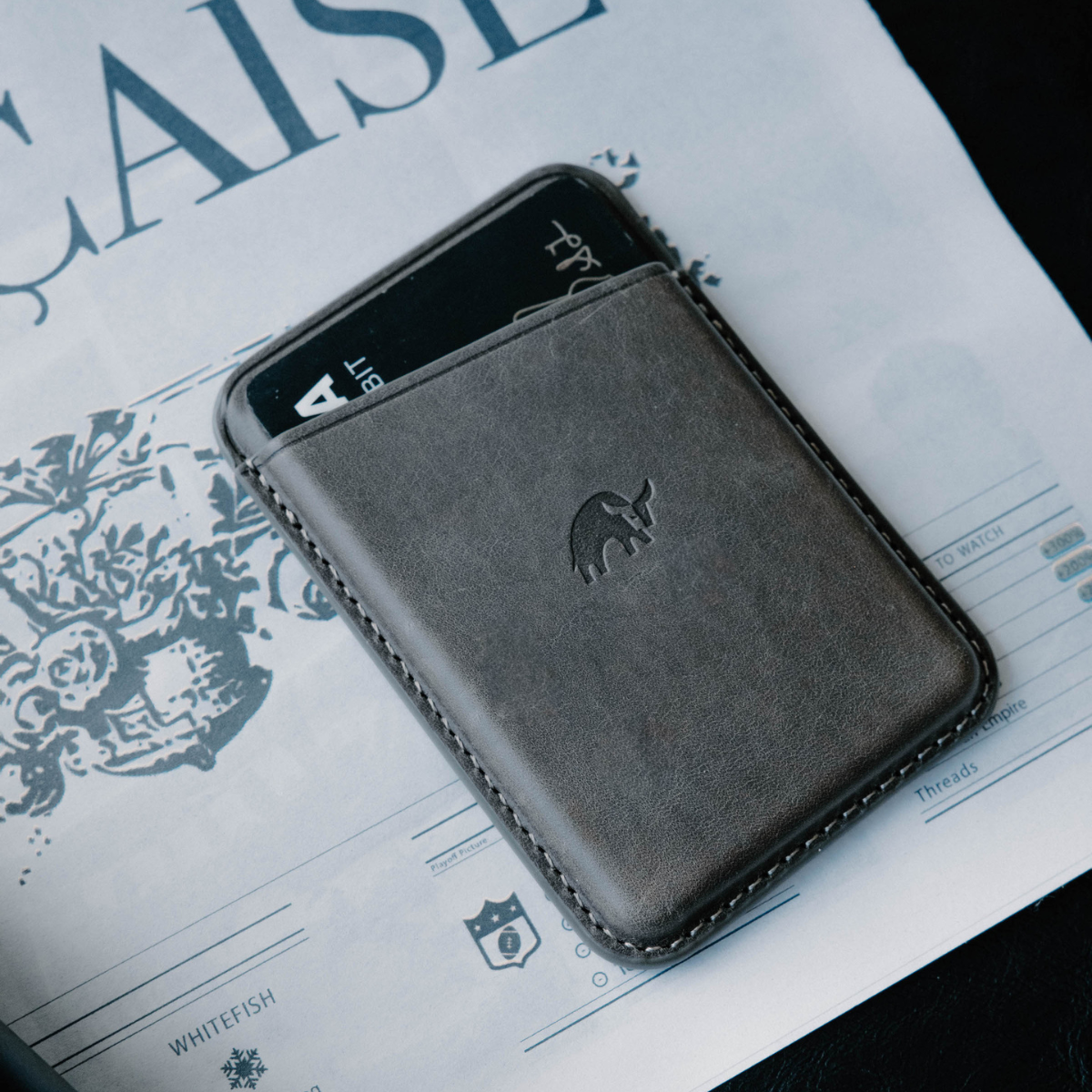 Slate leather magnetic wallet with a card slot, featuring a bull logo
