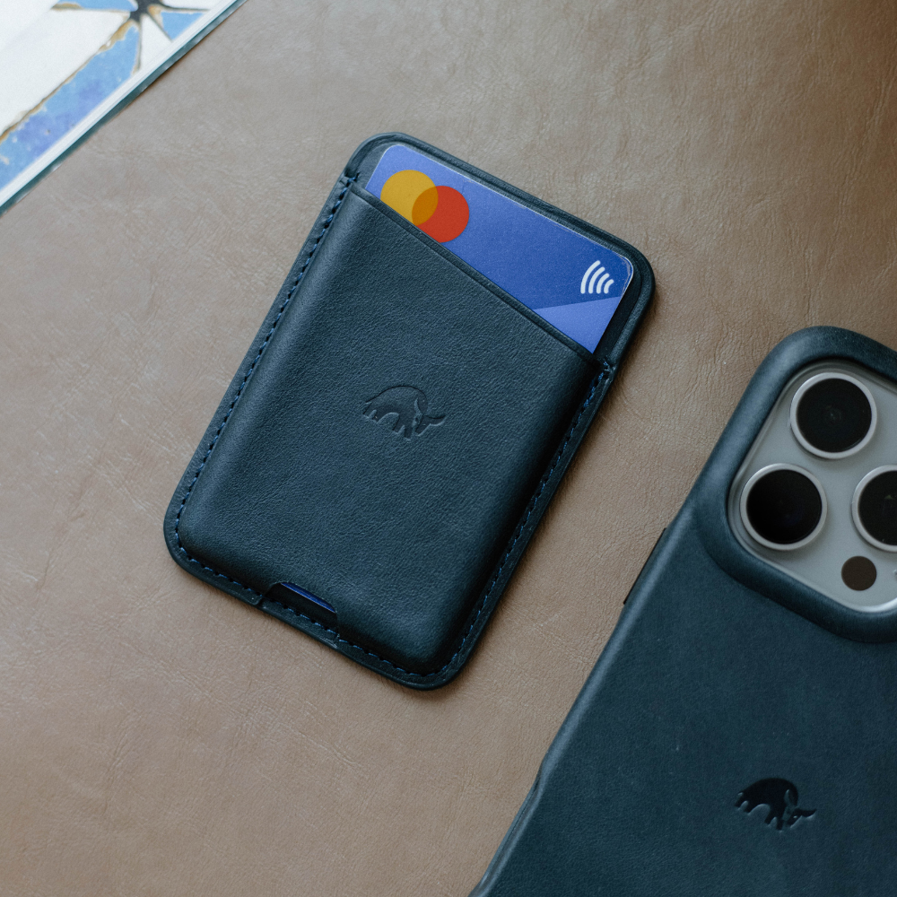 Leather Magnetic Wallet in Ocean color with a card partially visible