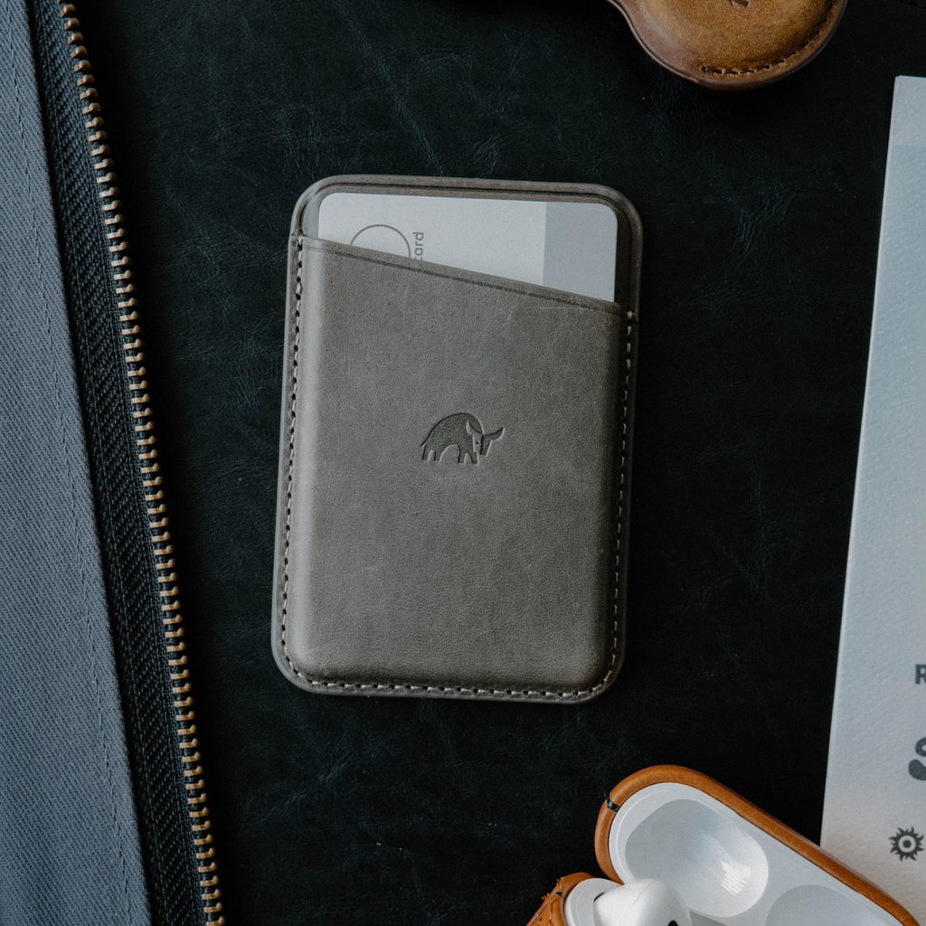 Leather Magnetic Wallet in Slate color, featuring a card slot and embossed logo.
