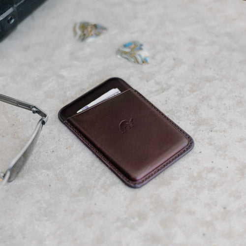 Leather Magnetic Wallet in Bourbon color, featuring a card slot and embossed logo.