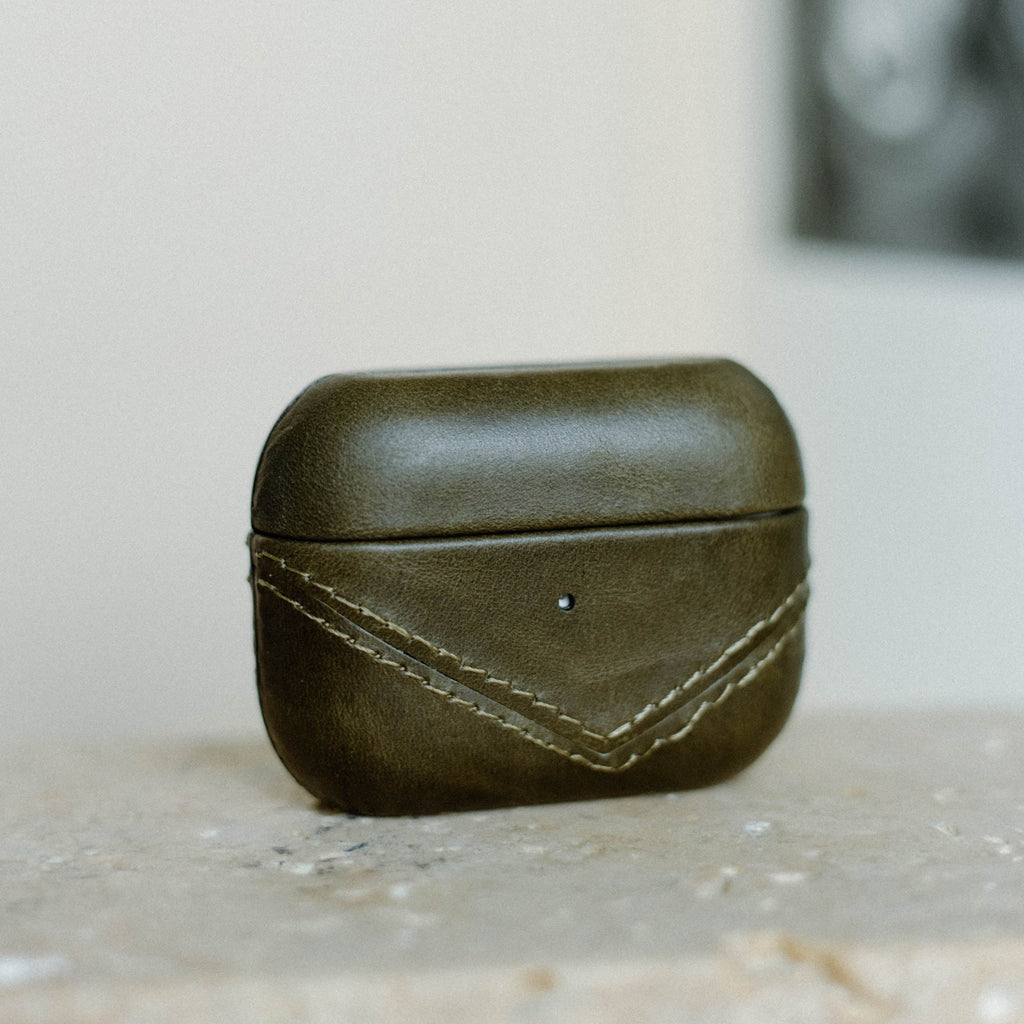 Olive green leather AirPods case with stitching detail