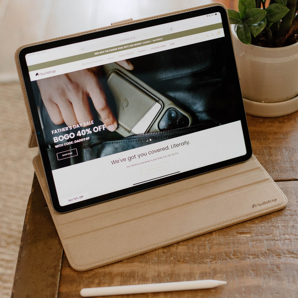 Leather iPad folio showing website text: FATHER'S DAY SALE; BOGO 40% OFF; WITH CODE: DADDY40; SHOP NOW; We've got you covered. Literally.; bullstrap