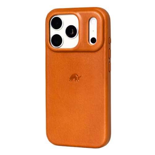 Three-quarter view of The Flex Case in Sienna leather showing raised camera lip and embossed bull logo on white background