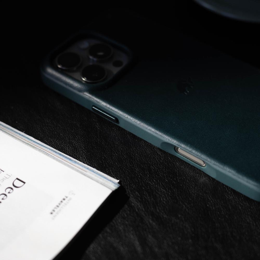 The Flex Case in Ocean color, showing the back and side buttons of the iPhone case.