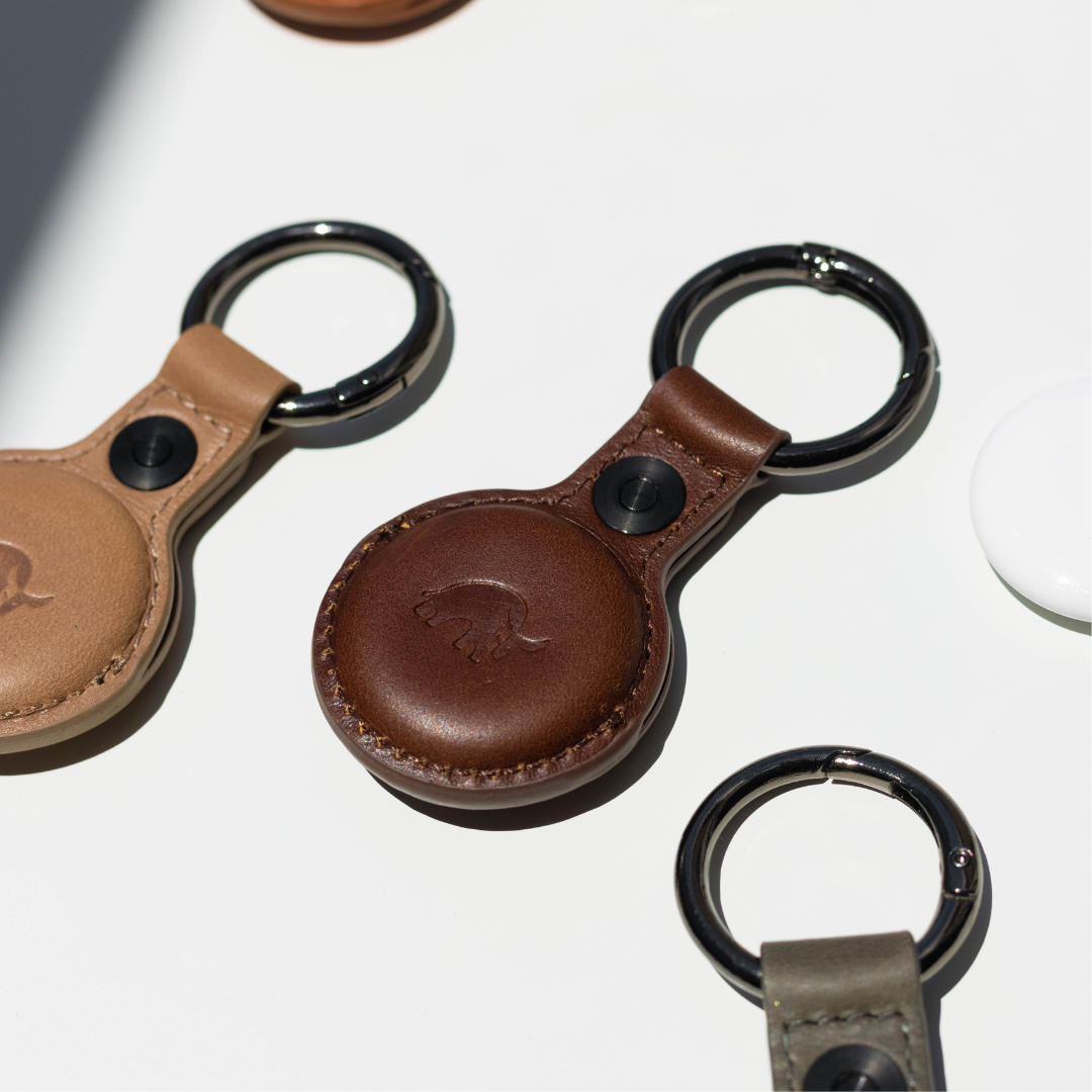 Brown leather BullTag keyring for AirTag with embossed bull logo and metal split ring.