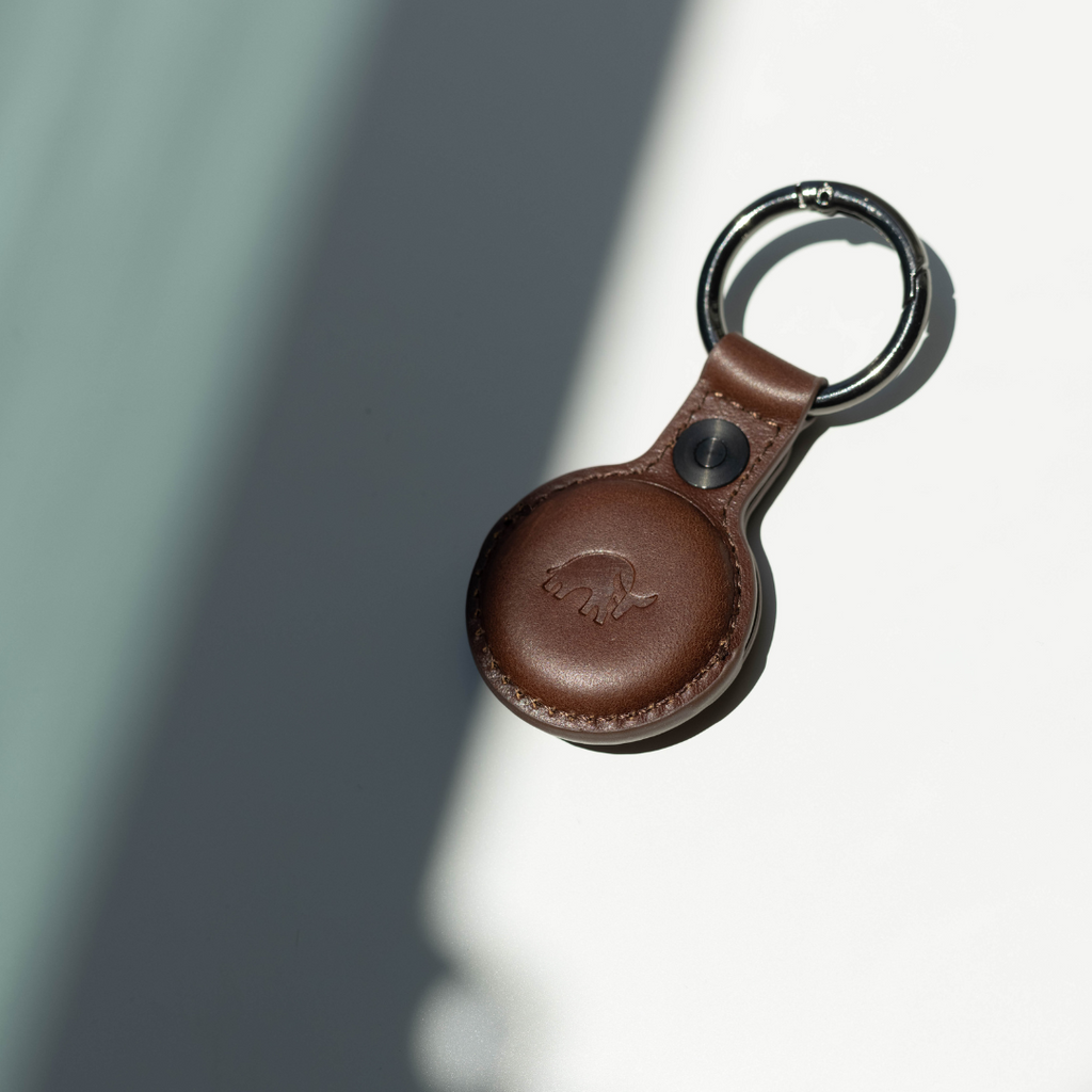 Brown leather BullTag AirTag keyring case with embossed bull logo and metal split ring