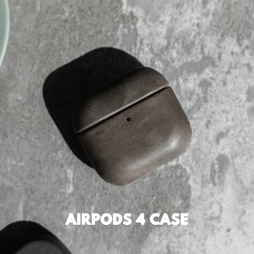 Slate leather AirPods case on concrete surface with shadow; visible text: AIRPODS 4 CASE