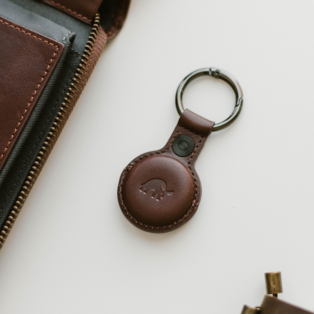 Brown leather BullTag keychain for AirTag with a bull logo