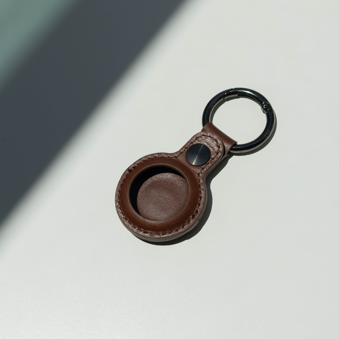 Brown leather AirTag keyring holder with black metal ring