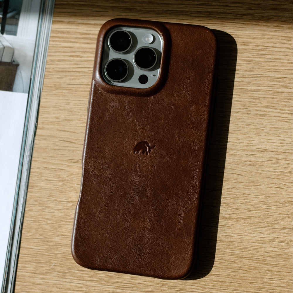 Brown leather phone case with camera cutout and embossed logo