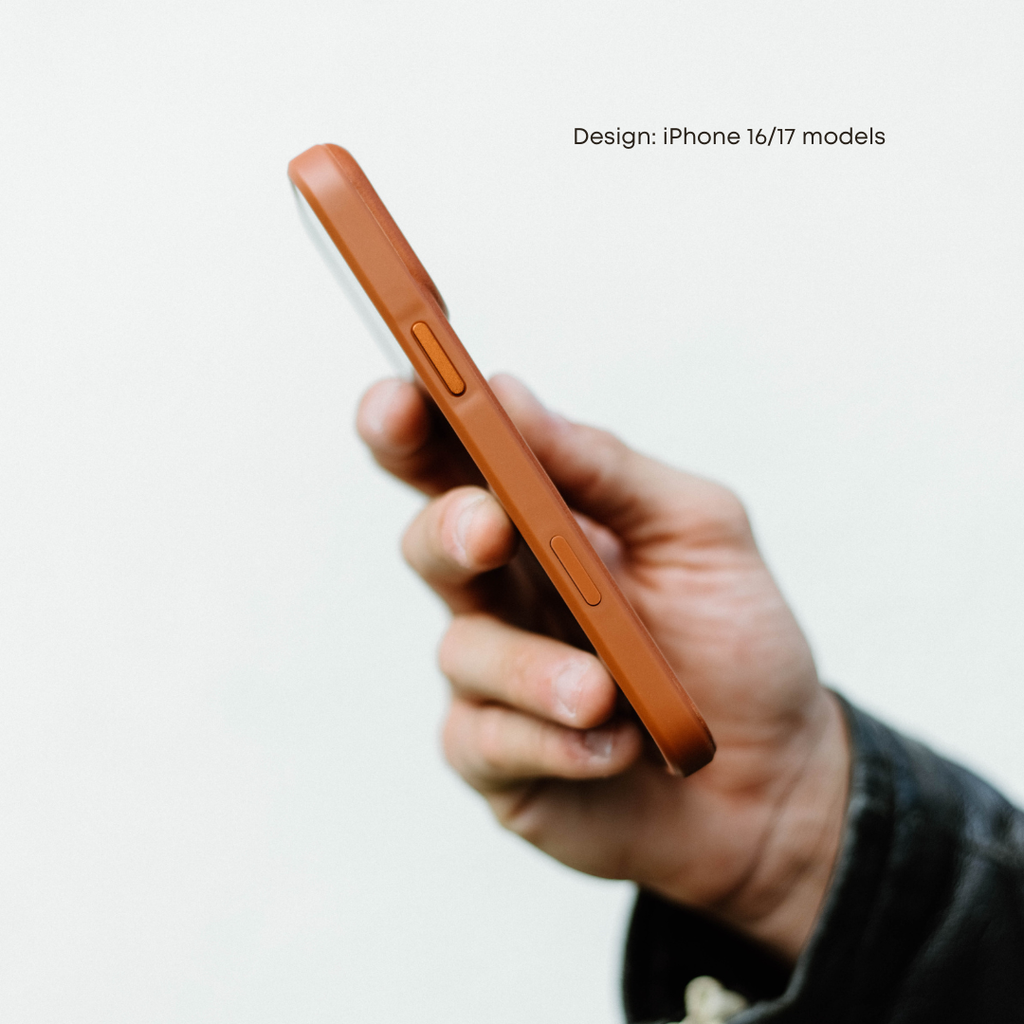 Angled side view of Sienna leather Flex Case showcasing tactile side buttons and slim profile while held in hand against a soft white background
