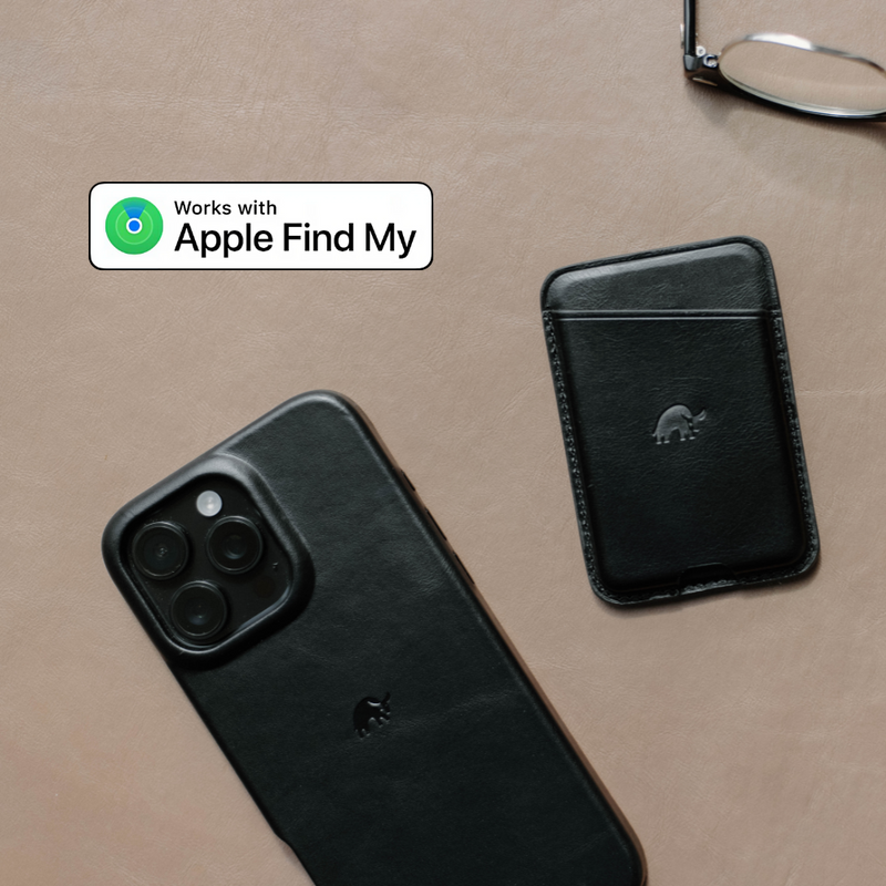 A black wallet next to a phone, both featuring the Bullstrap logo and text indicating compatibility with Apple Find My.