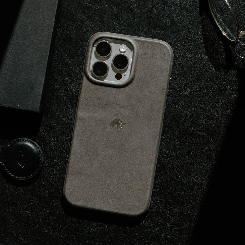The Flex Case in Sienna color on a dark surface