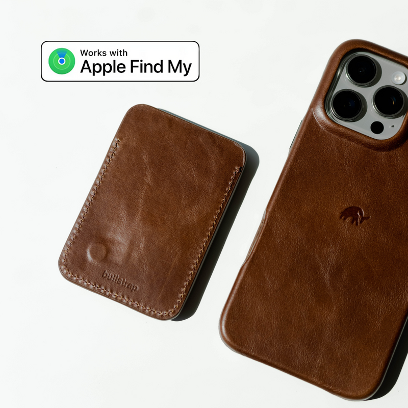 Brown leather iPhone case and matching MagSafe wallet stamped bullstrap, with badge reading 'Works with Apple Find My'