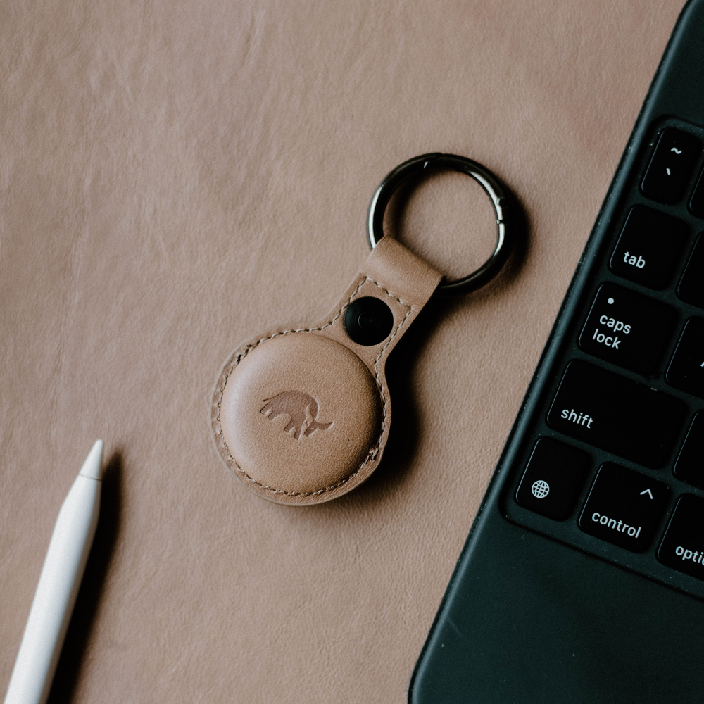BullTag for AirTag in DUNE color, featuring a leather keychain with a logo.