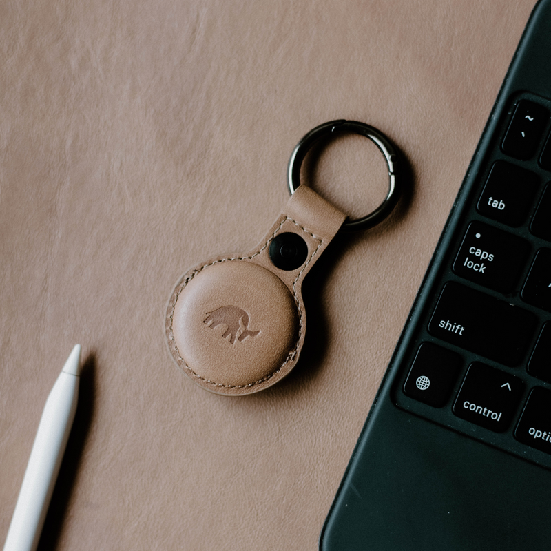 BullTag for AirTag in DUNE color, featuring a leather keychain with a logo.