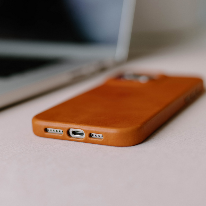 Close-up of the SIENNA Contemporary Case for iPhone 16, showing ports and texture.