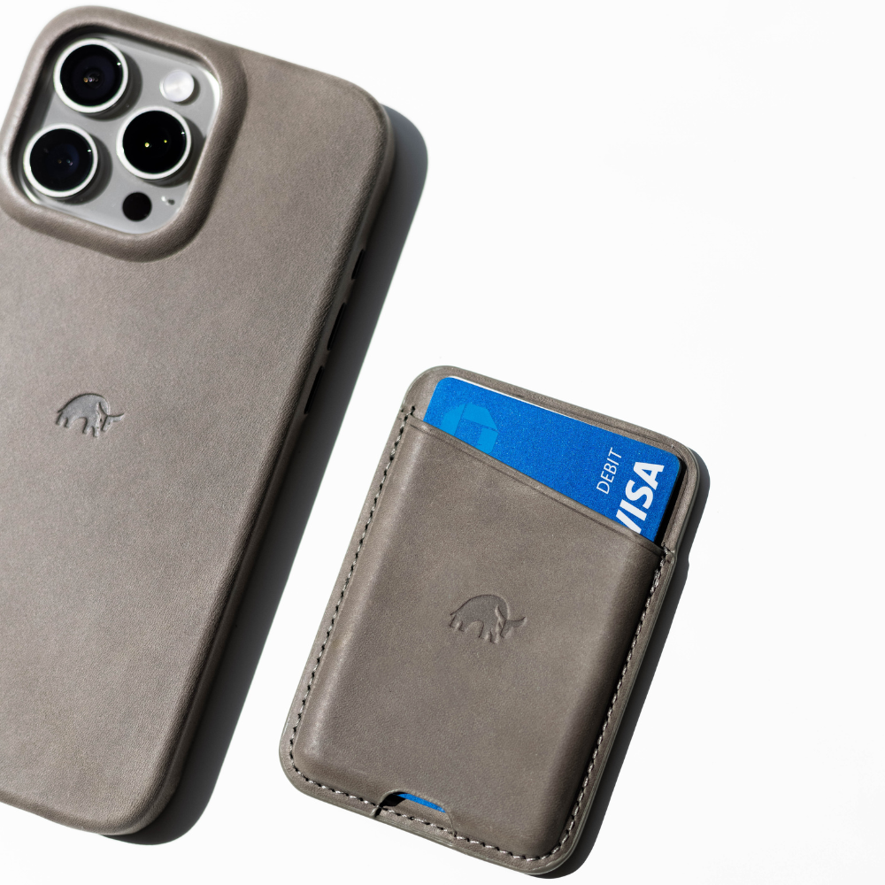 Leather Magnetic Wallet in Slate color, featuring a card slot and a phone case beside it.