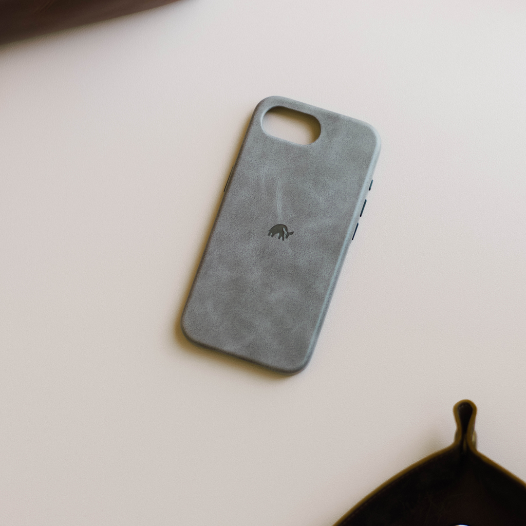 slate gray suede-like minimalist phone case with small centered elephant logo