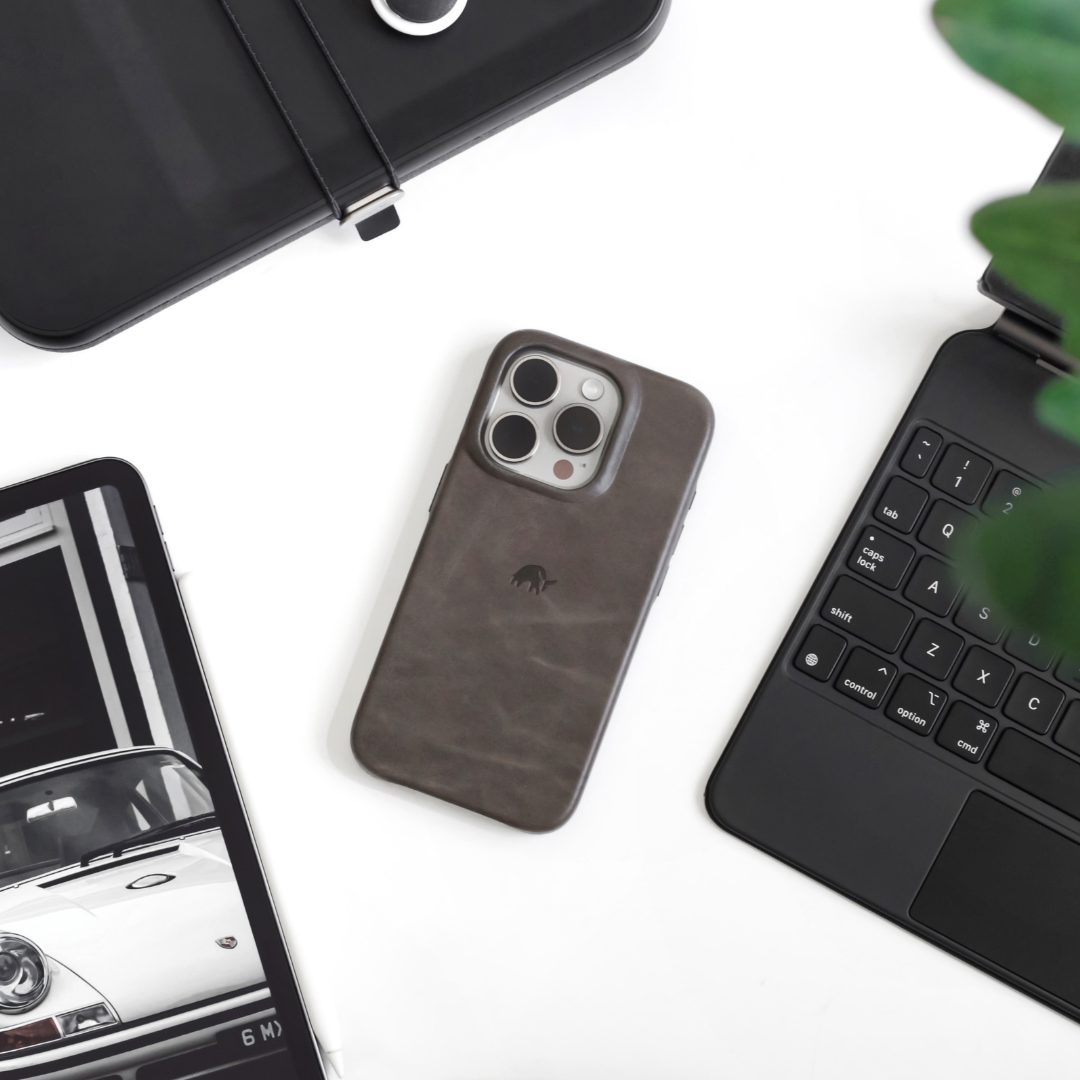 Slate iPhone case with elephant logo; visible words: tab, caps lock, shift, control, option, cmd, Q, A, S, Z, X, C