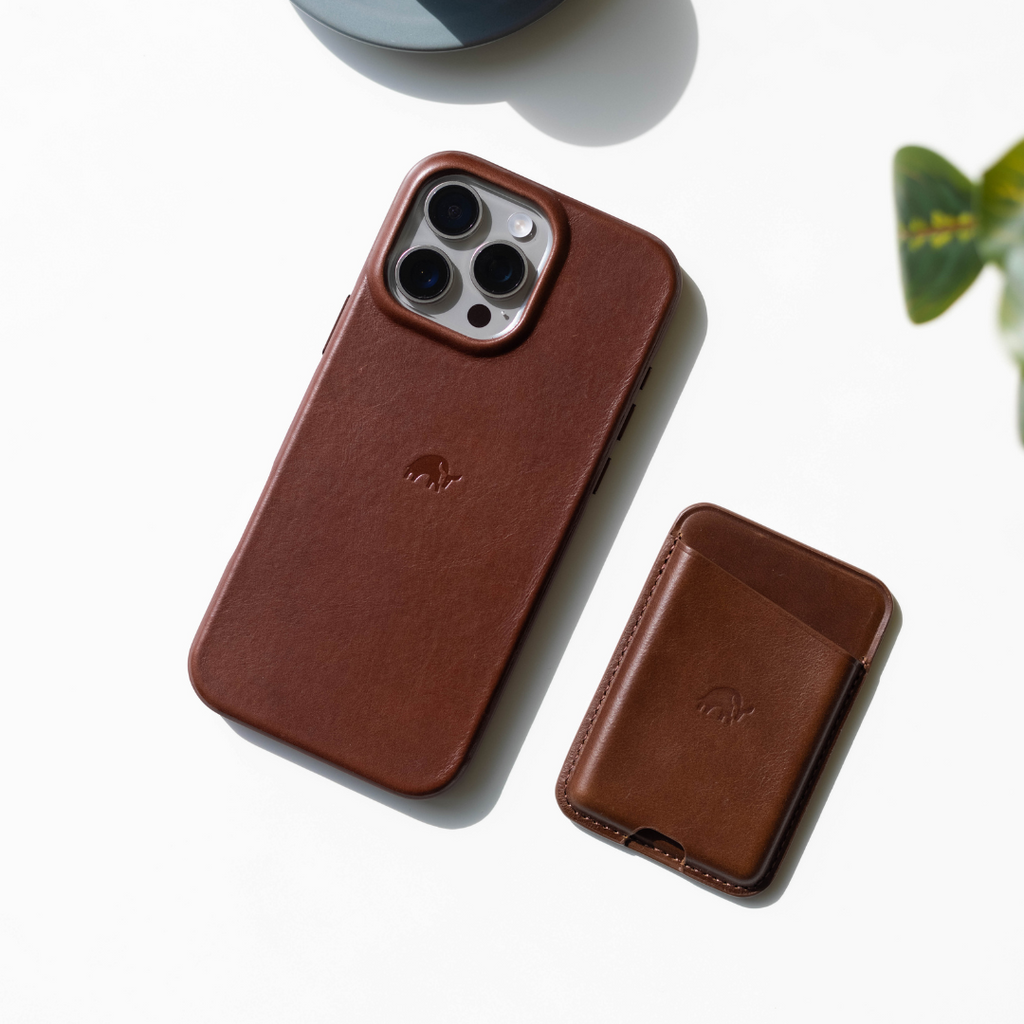 Brown leather Flex Case for iPhone with matching wallet on a white background
